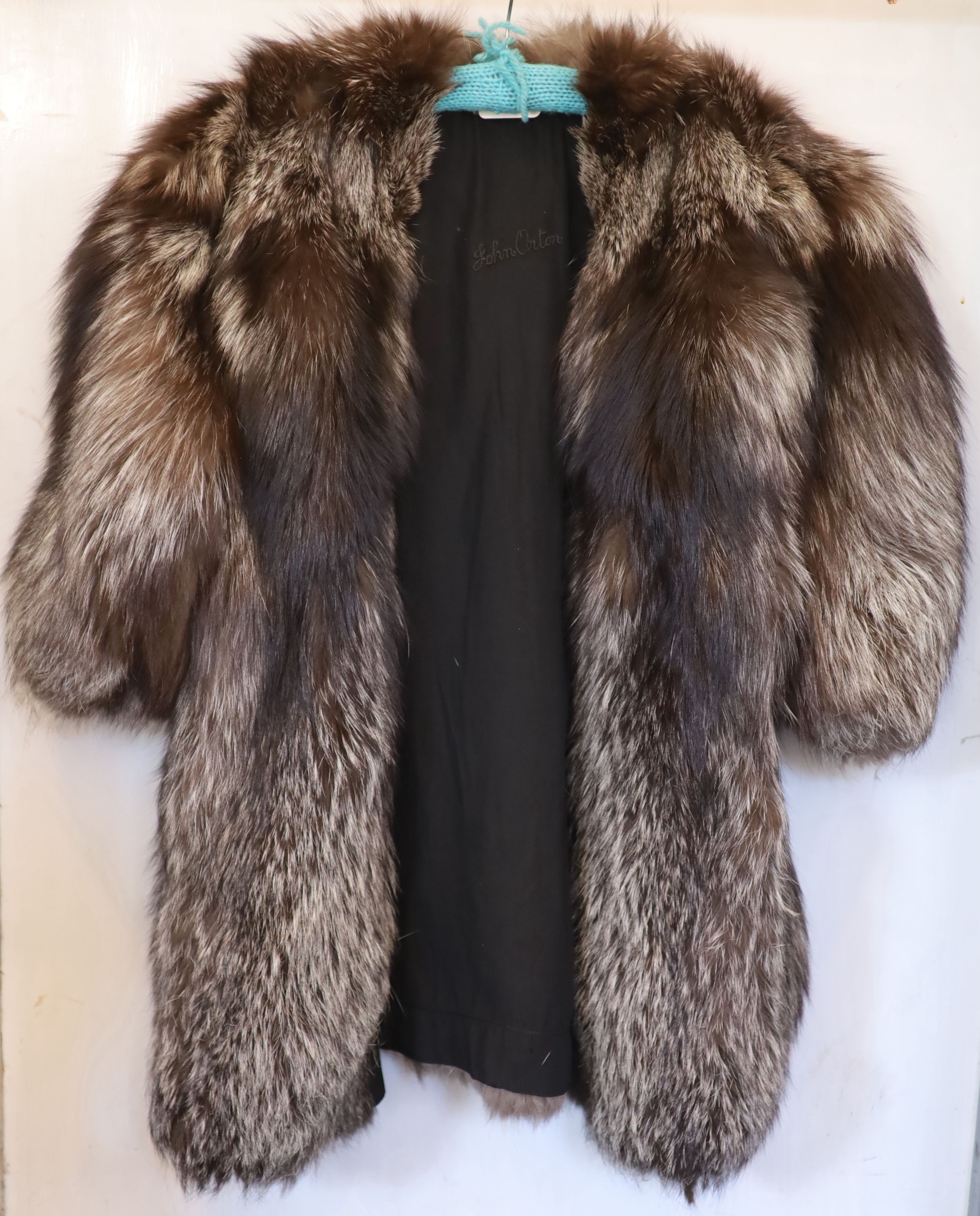 A silver fox three quarter length jacket,